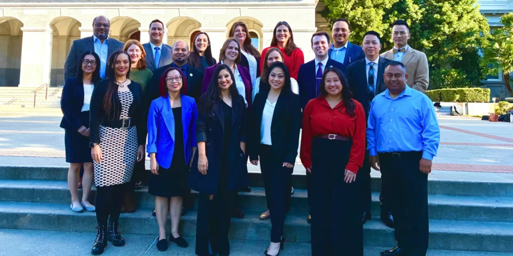 All 20 members of cohort 2 of the Governor's Innovation Fellows outside the California Capitol.
