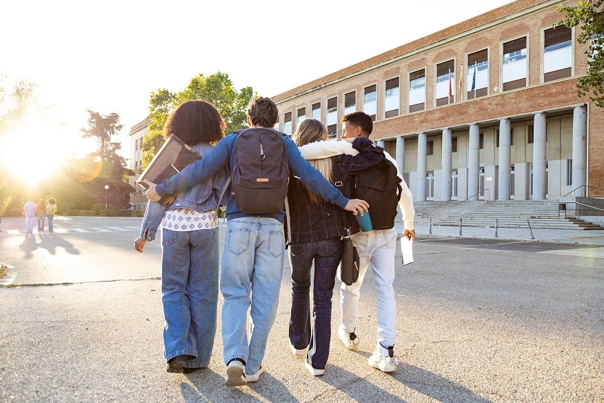 A group of students walking across campus