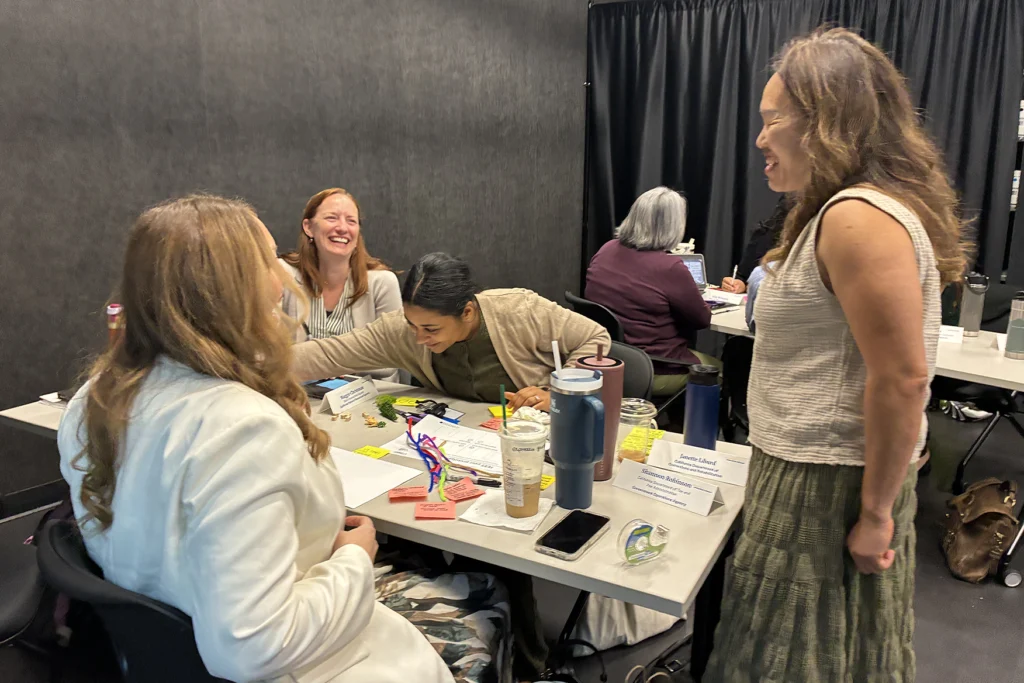 Members of cohort 3 of the Governor's Innovation Fellows work together at the bootcamp